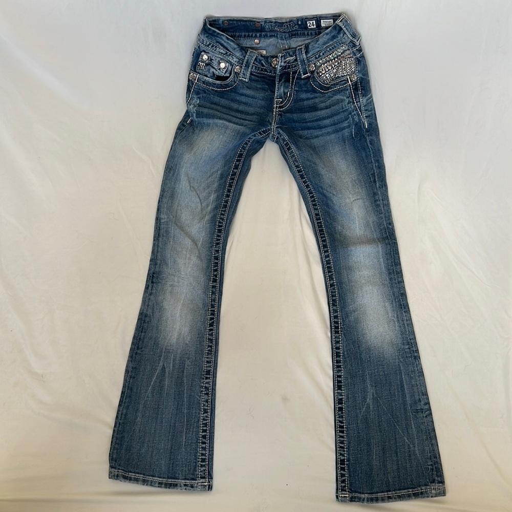 Miss Me low waisted, boot cut, distressed look jeans.